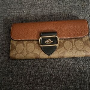 Coach Signature Brown and Tan Clutch